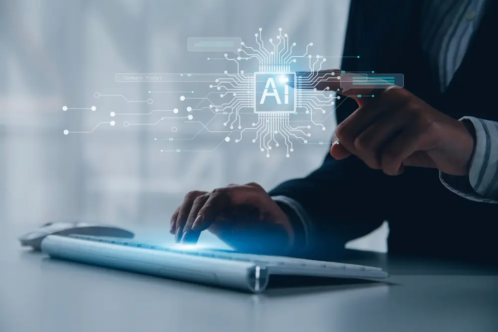 A businessman using AI on a keyboard.