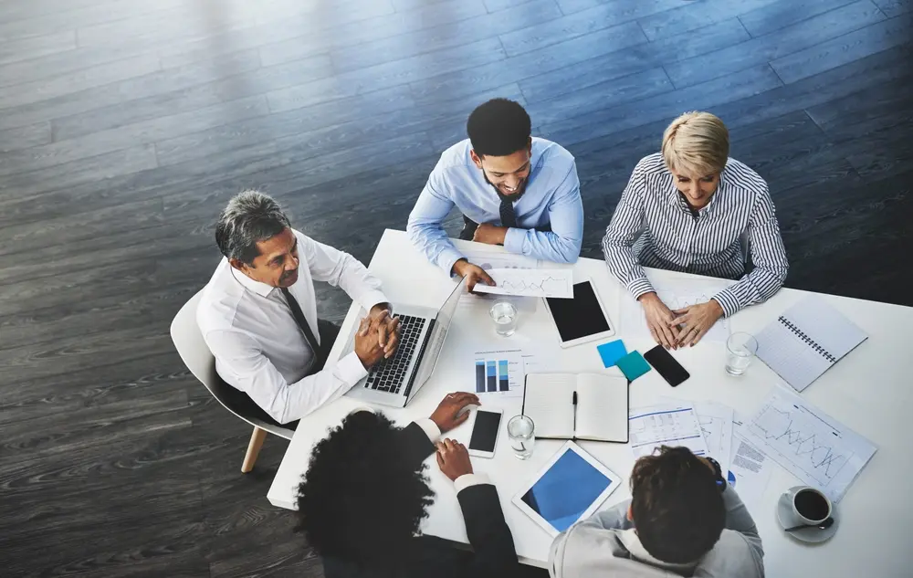 A group of businesspeople at a conference table.